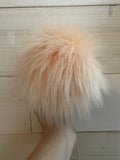 Peachy faux fur Pom Pom