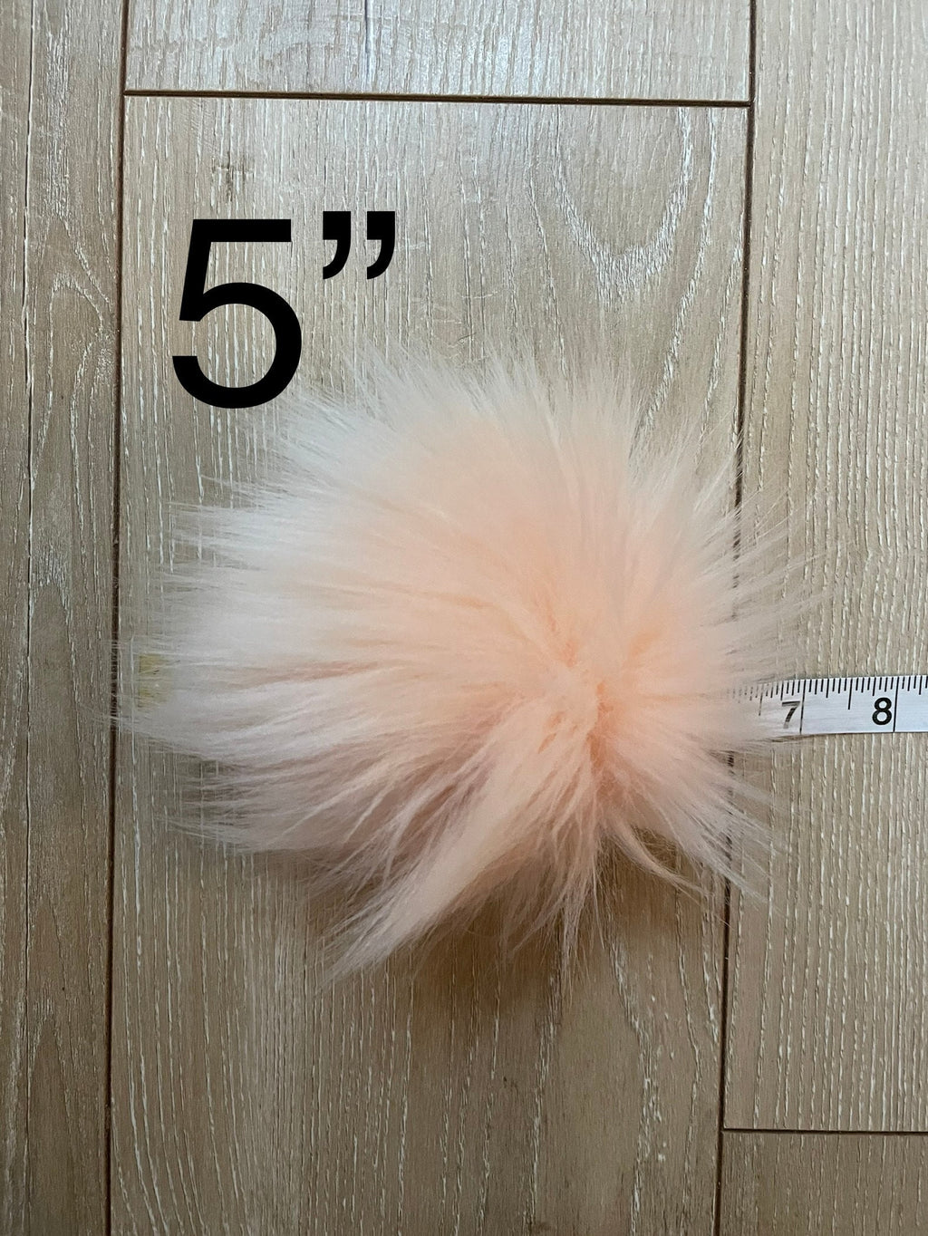 Peachy faux fur Pom Pom