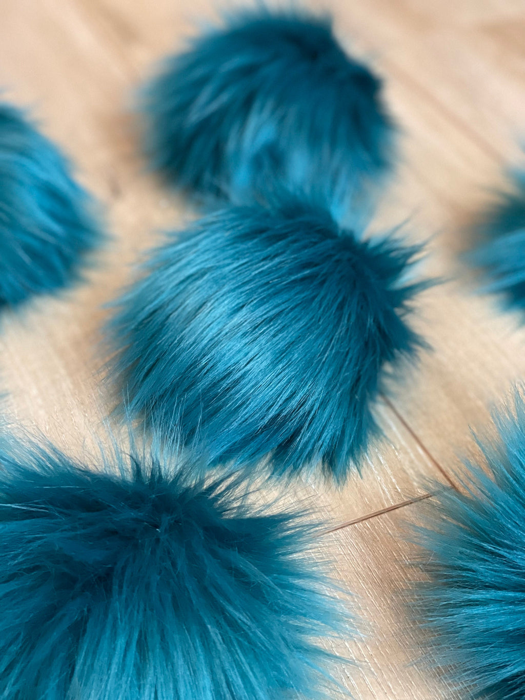 Teal faux fur Pom Poms