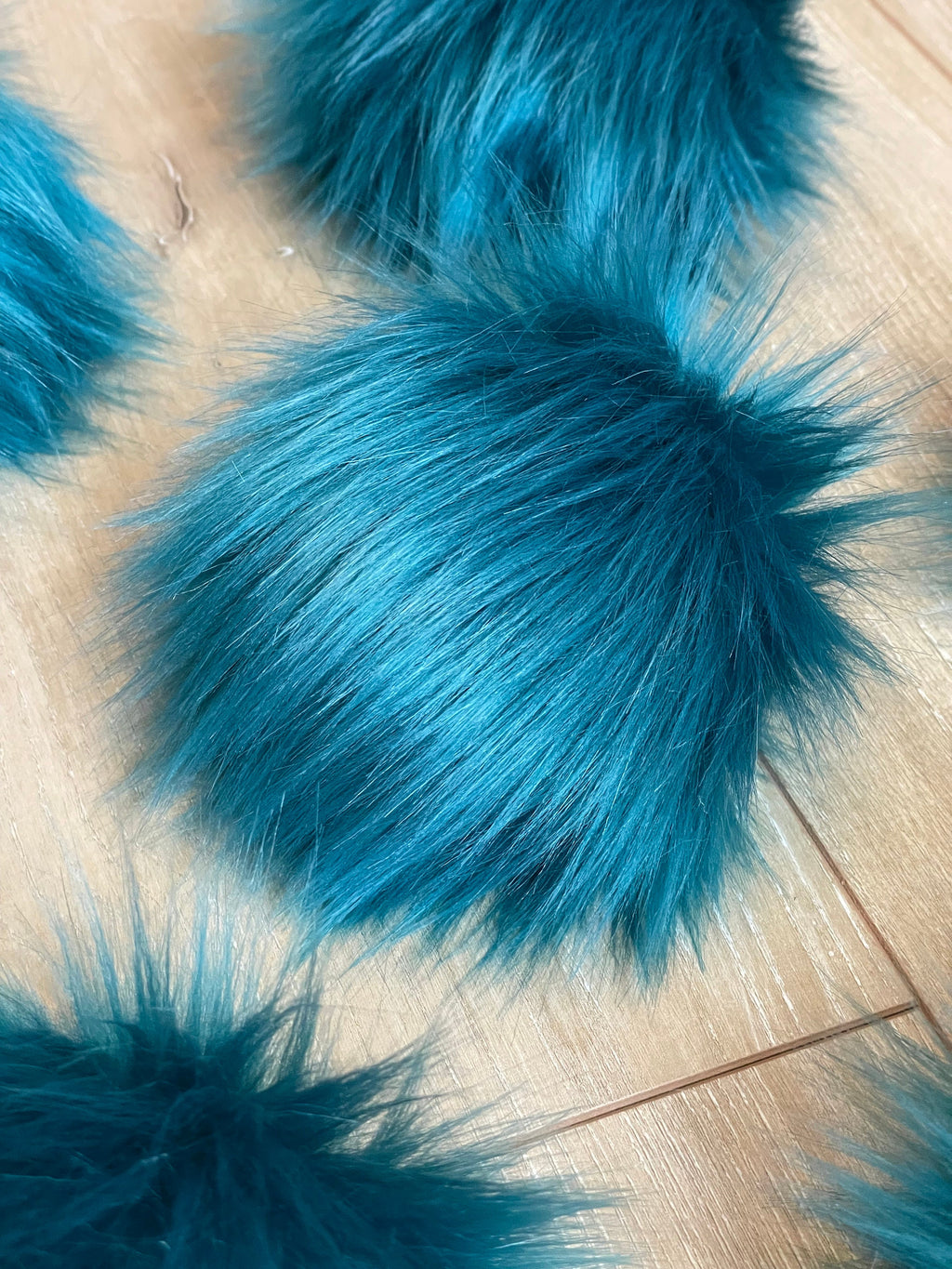 Teal faux fur Pom Poms