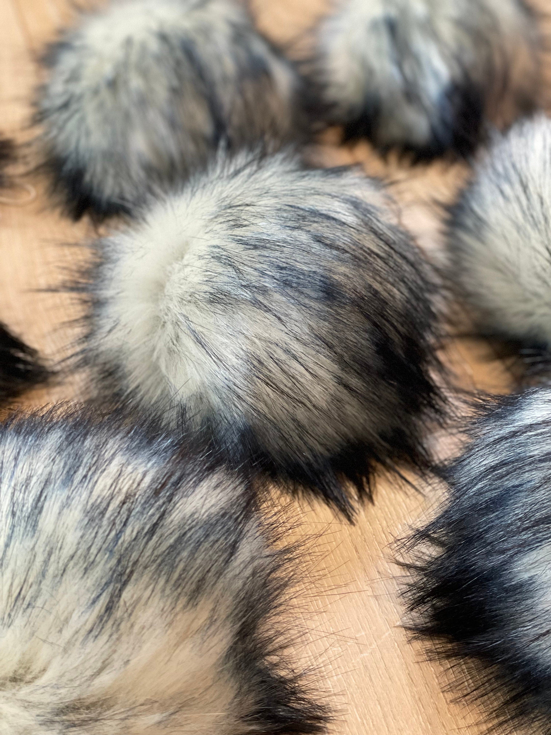 Navy tips luxe faux fur Pom