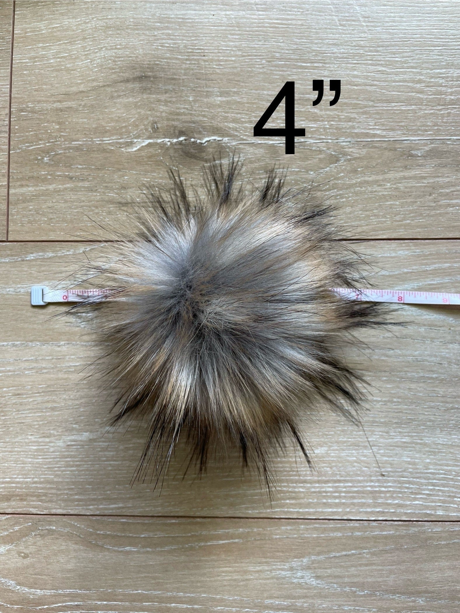 Raccoon luxe faux fur pom pom
