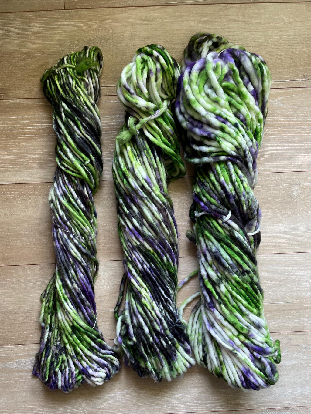 Beetle hand dyed super bulky merino wool, 98 yard, 6 weight purple green black speckled, semi solid, multicolor, indie dye, superwash