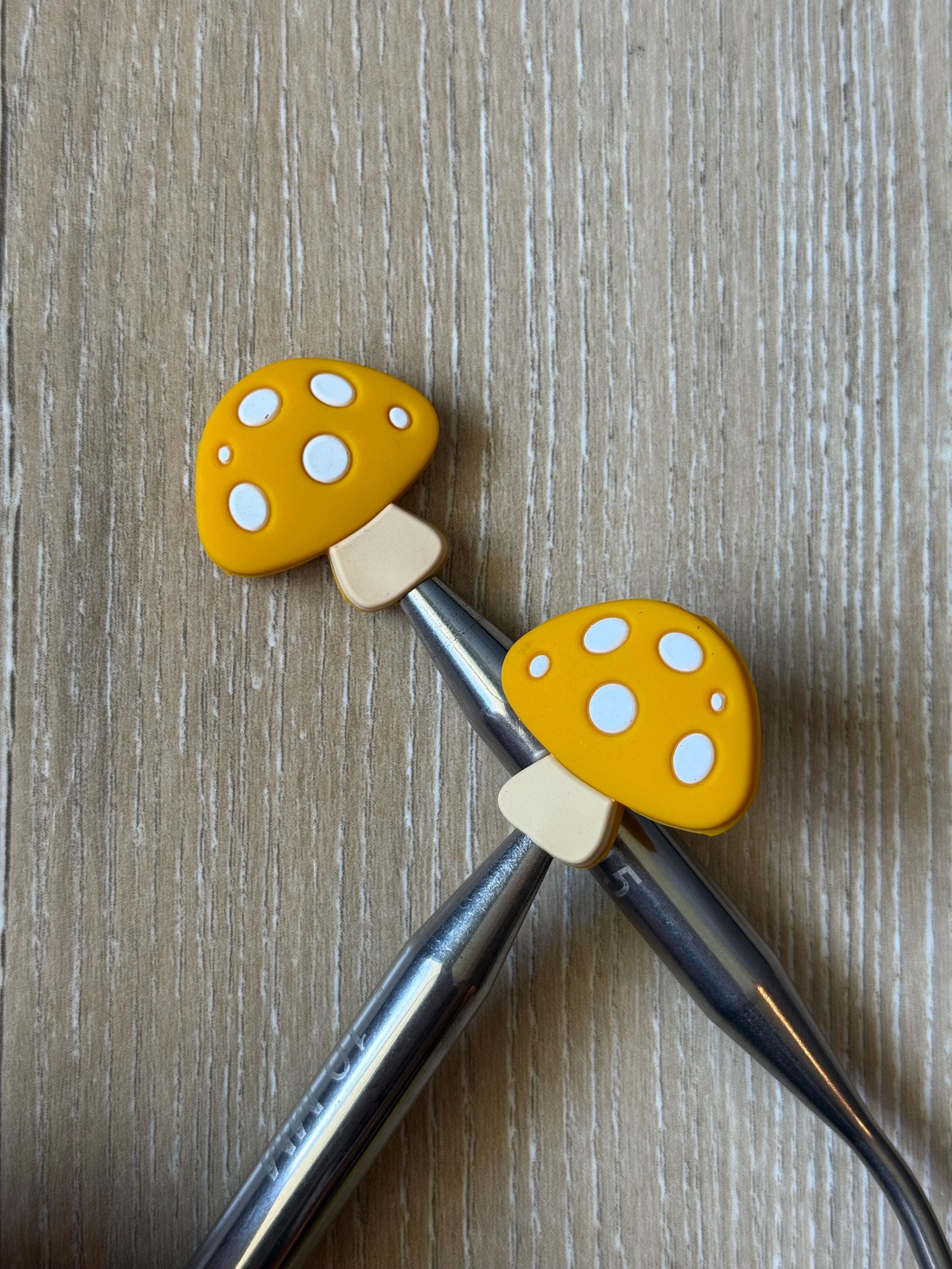 Mushroom needle stoppers for knitting needles