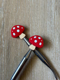 Mushroom needle stoppers for knitting needles