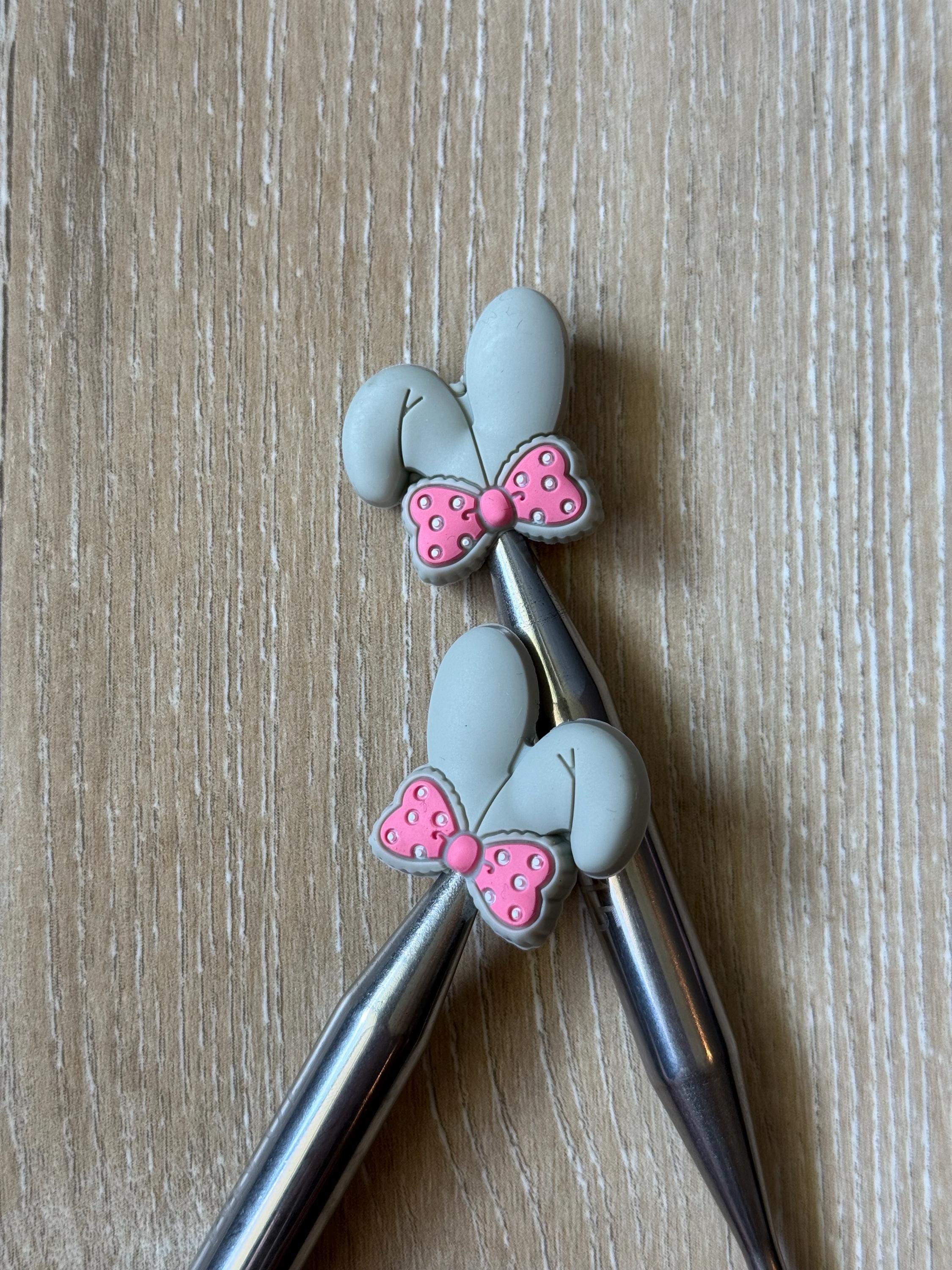Bunny ears needle stoppers for knitting needles