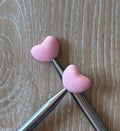 Heart needle stoppers for knitting needles