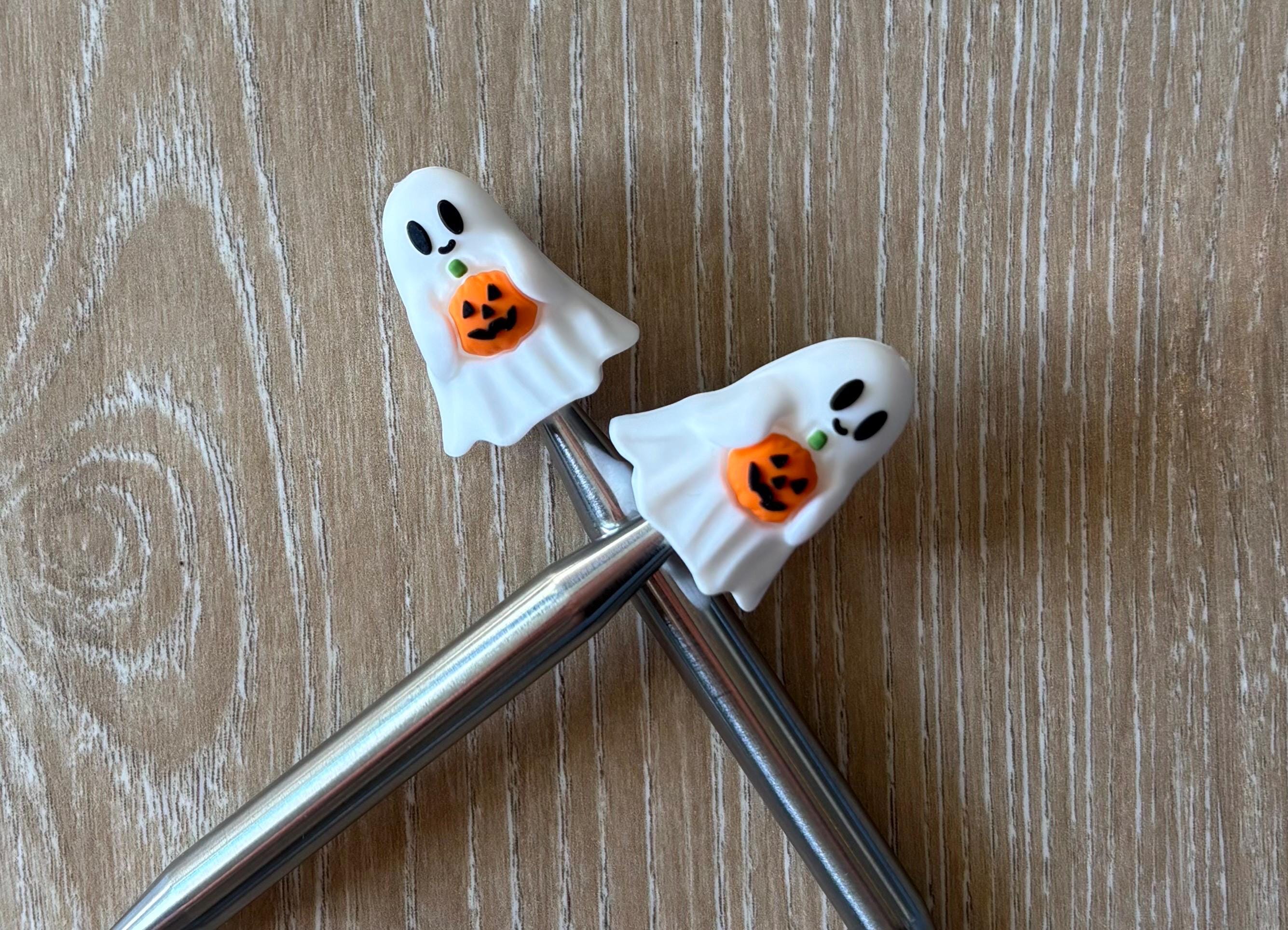 Ghost needle stoppers for knitting needles