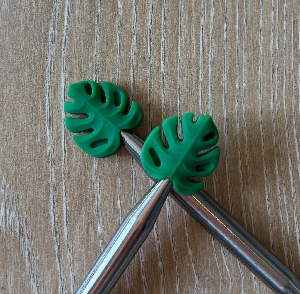 Leaf needle stoppers for knitting needles