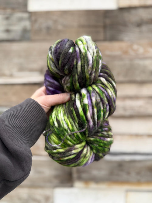 Beetle hand dyed super bulky merino wool, 98 yard, 6 weight purple green black speckled, semi solid, multicolor, indie dye, superwash