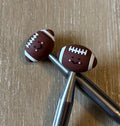 Football needle stoppers for knitting needles