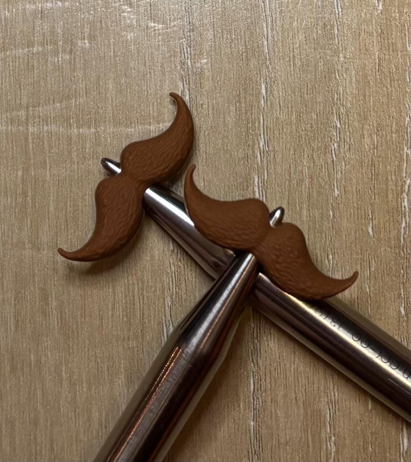 Mustache needle stoppers for knitting needles