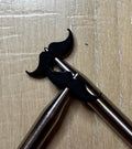 Mustache needle stoppers for knitting needles
