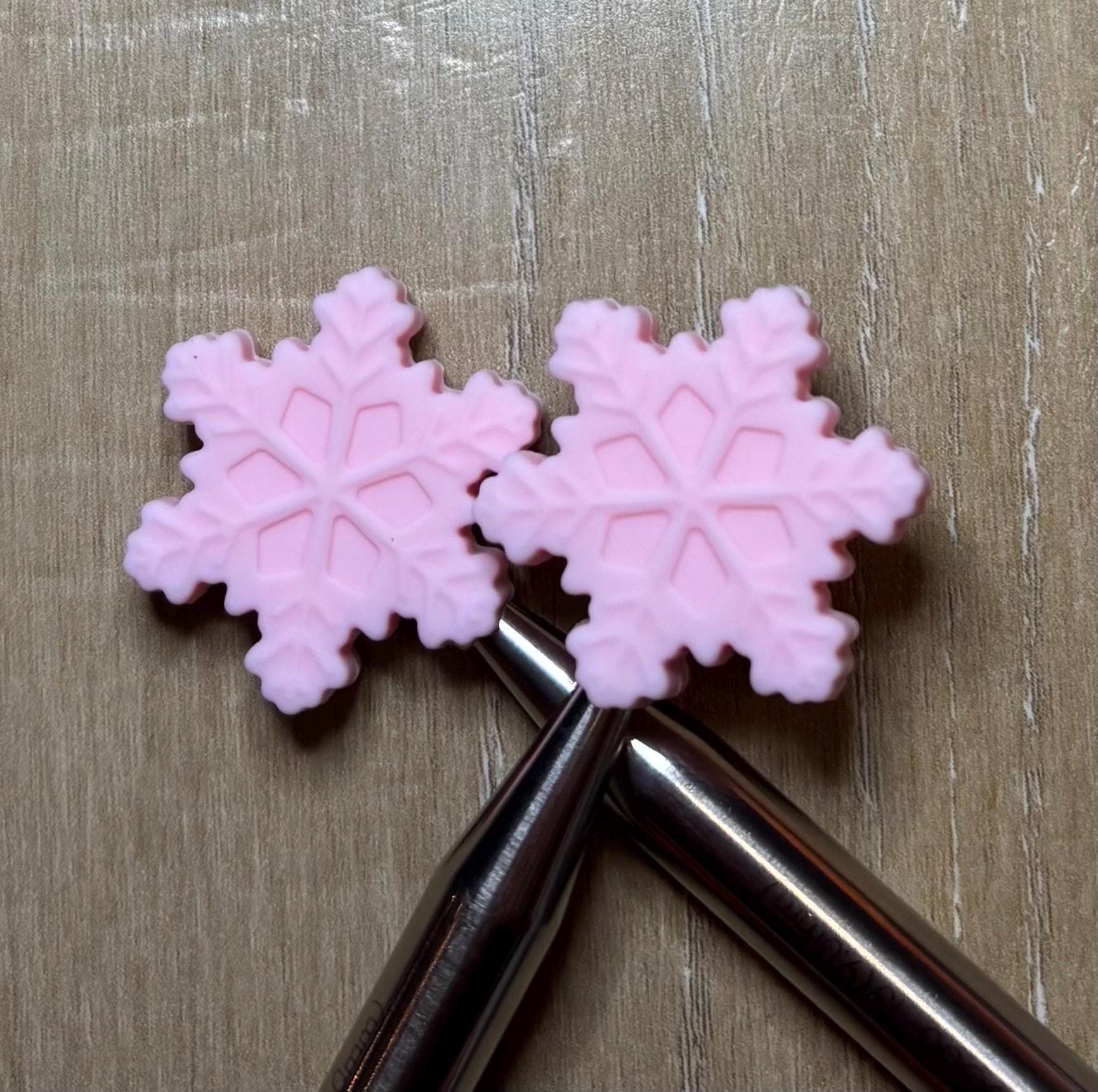 Snowflake needle stoppers for knitting needles