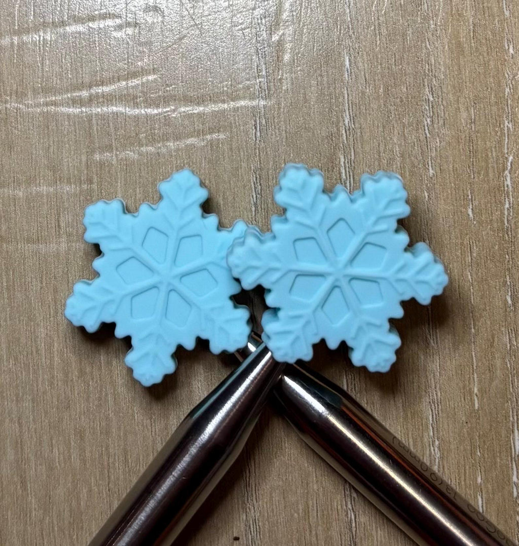 Snowflake needle stoppers for knitting needles