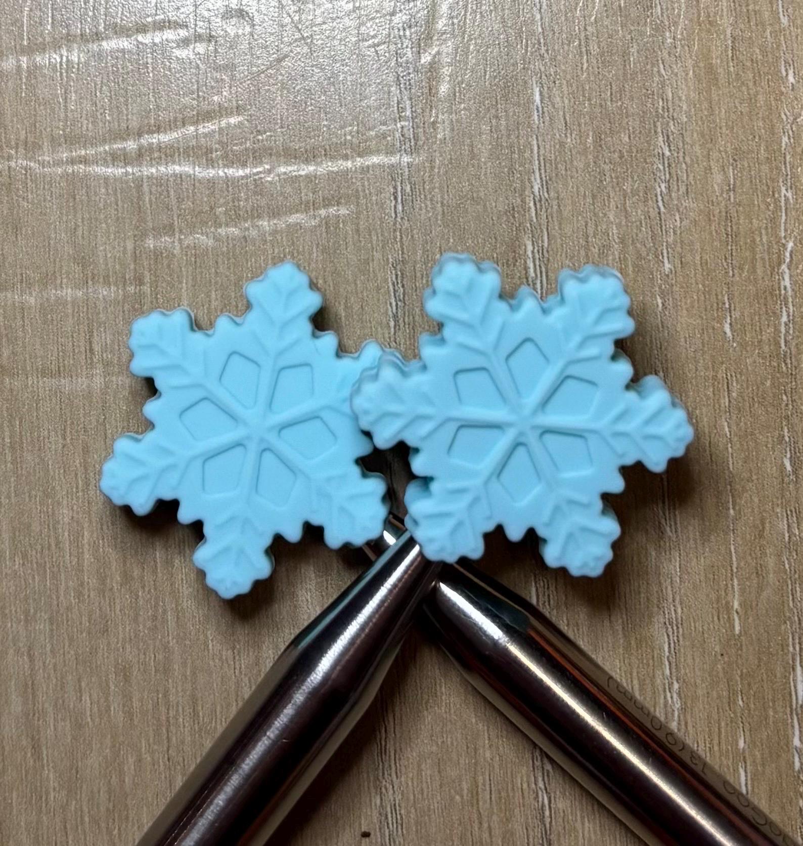 Snowflake needle stoppers for knitting needles