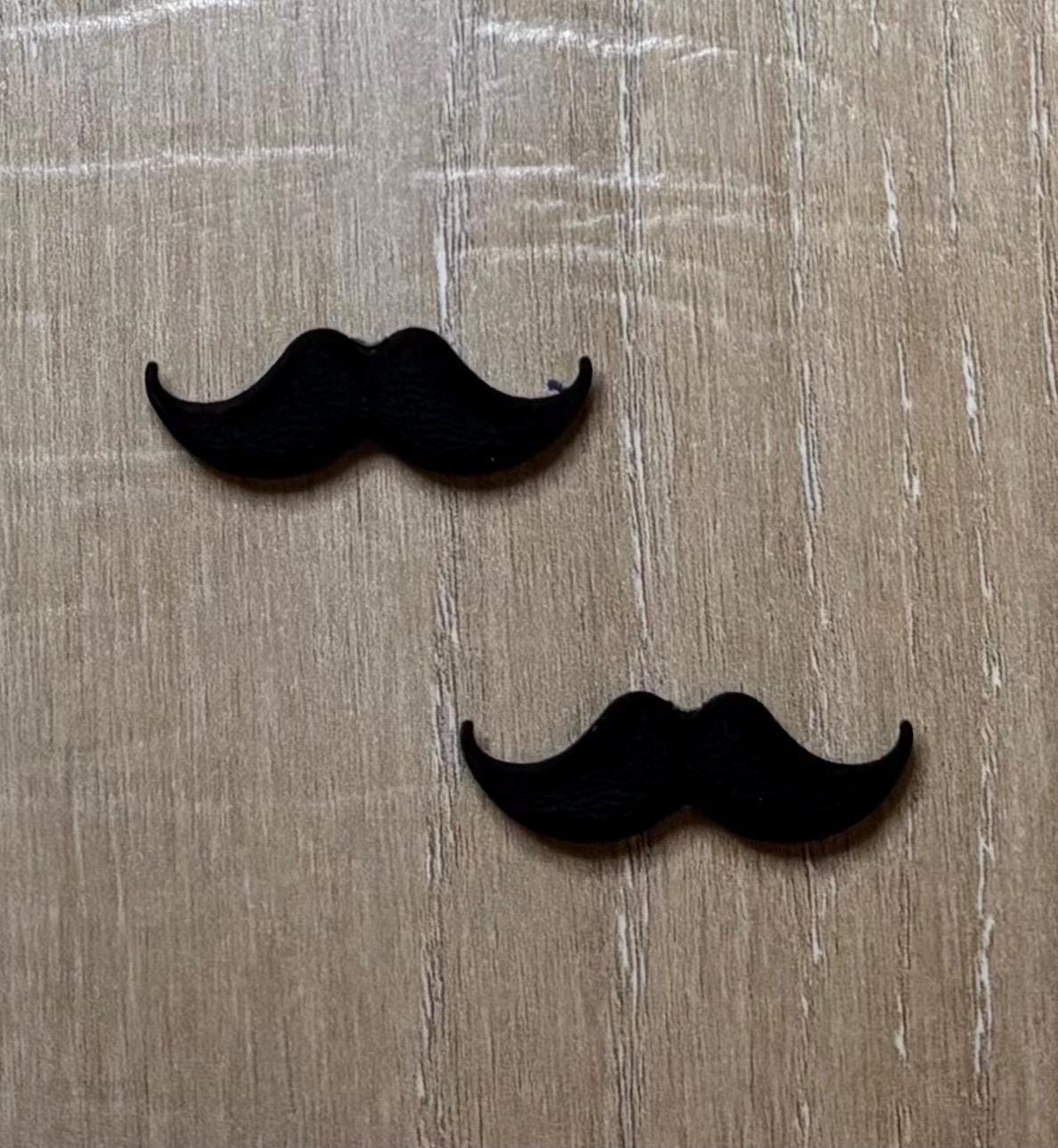 Mustache needle stoppers for knitting needles