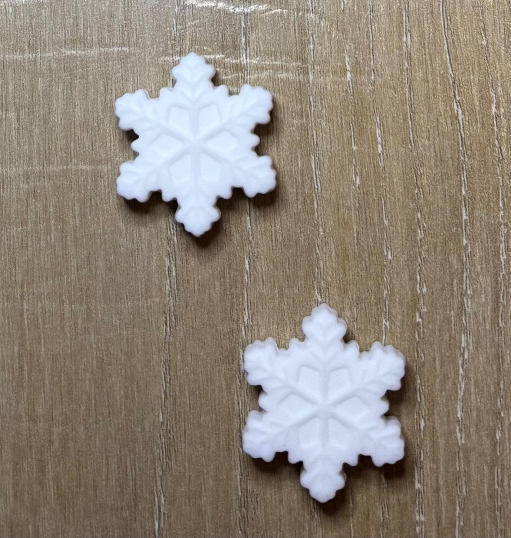 Snowflake needle stoppers for knitting needles