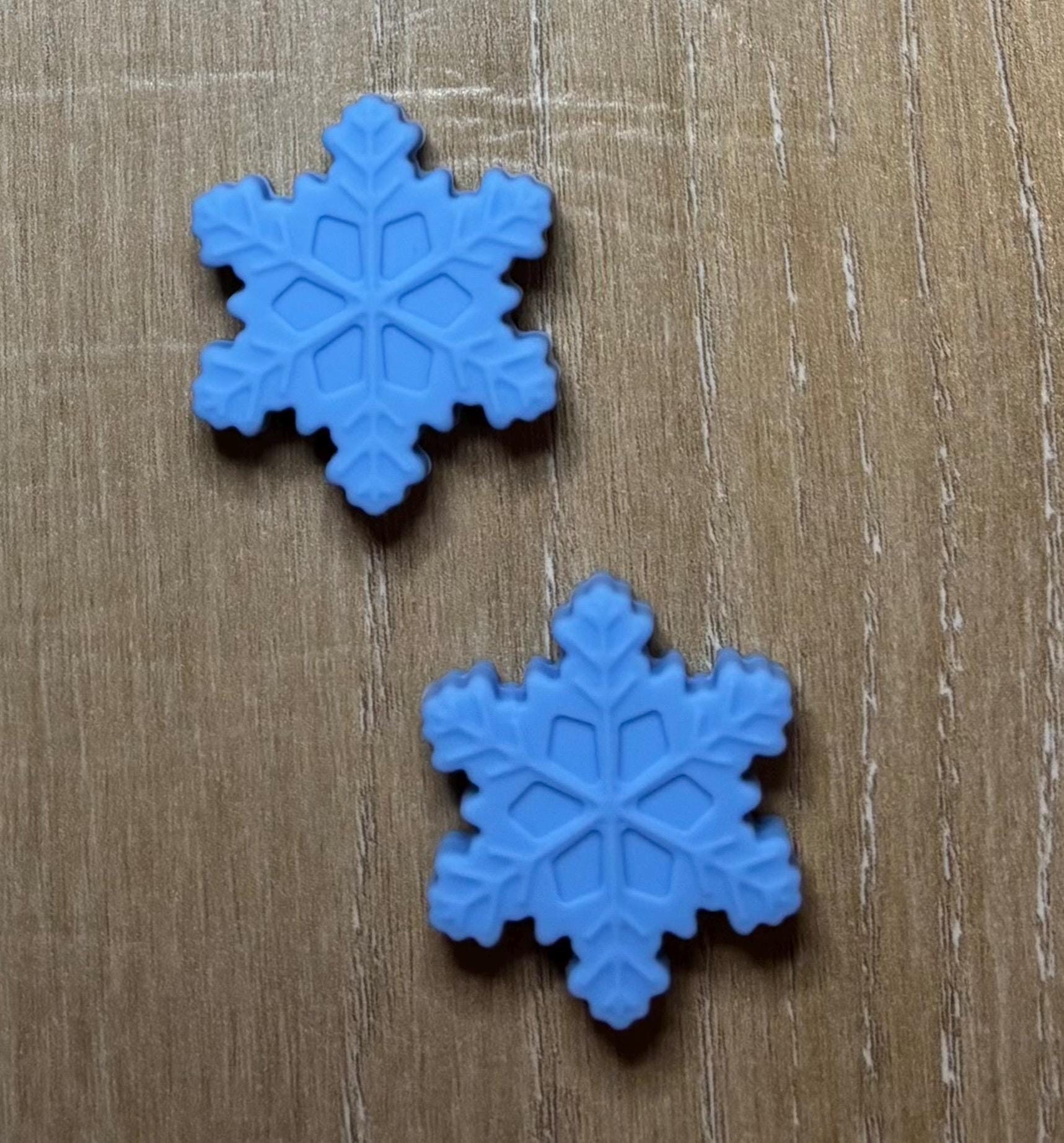 Snowflake needle stoppers for knitting needles