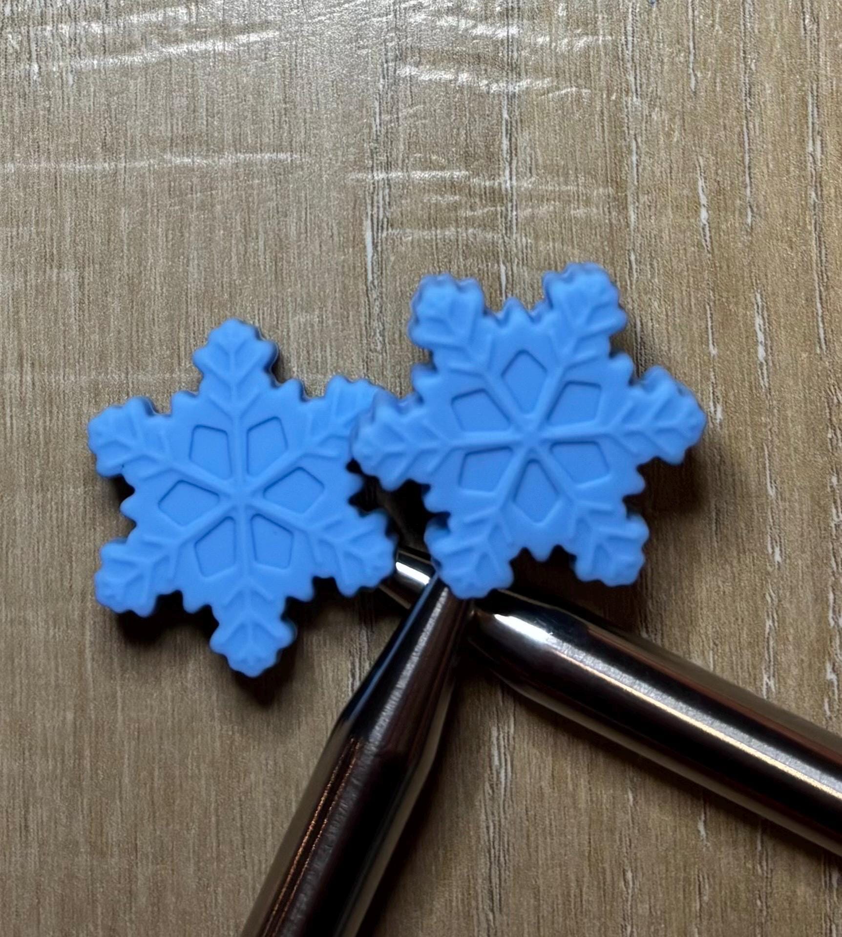Snowflake needle stoppers for knitting needles