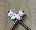 Snowman needle stoppers for knitting needles