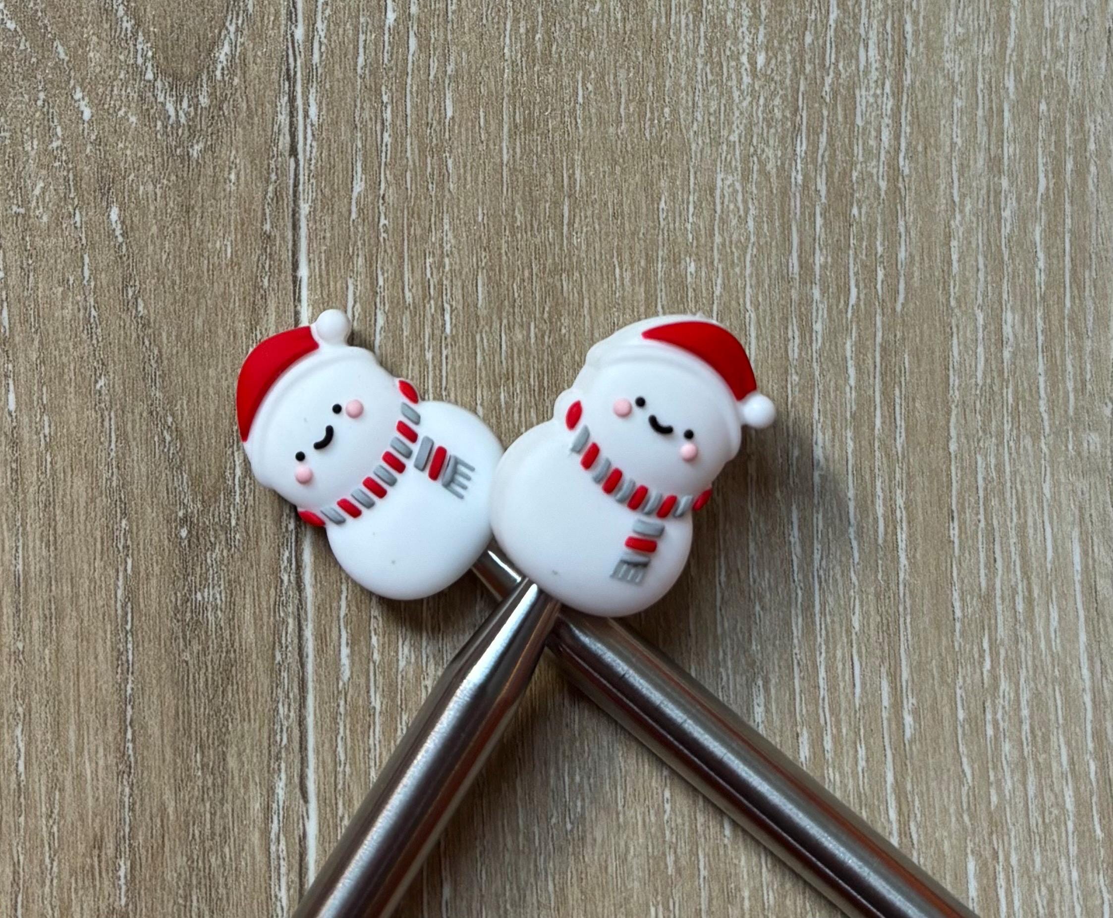 Snowman needle stoppers for knitting needles