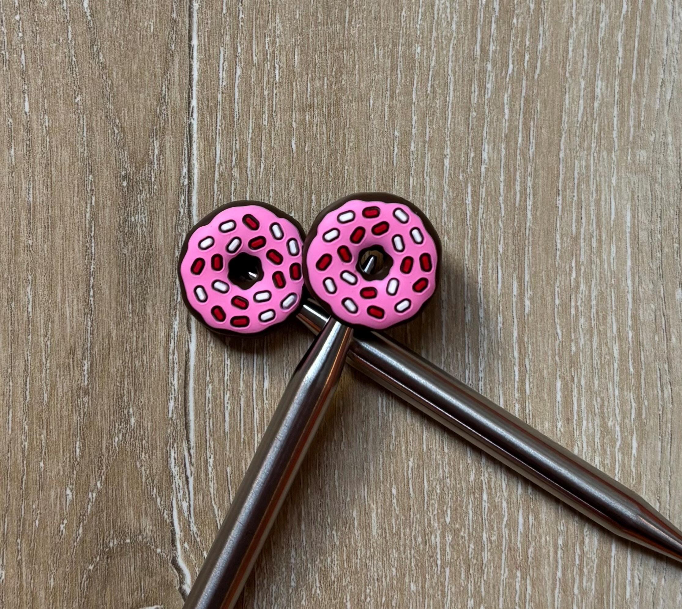 Donut needle stoppers for knitting needles