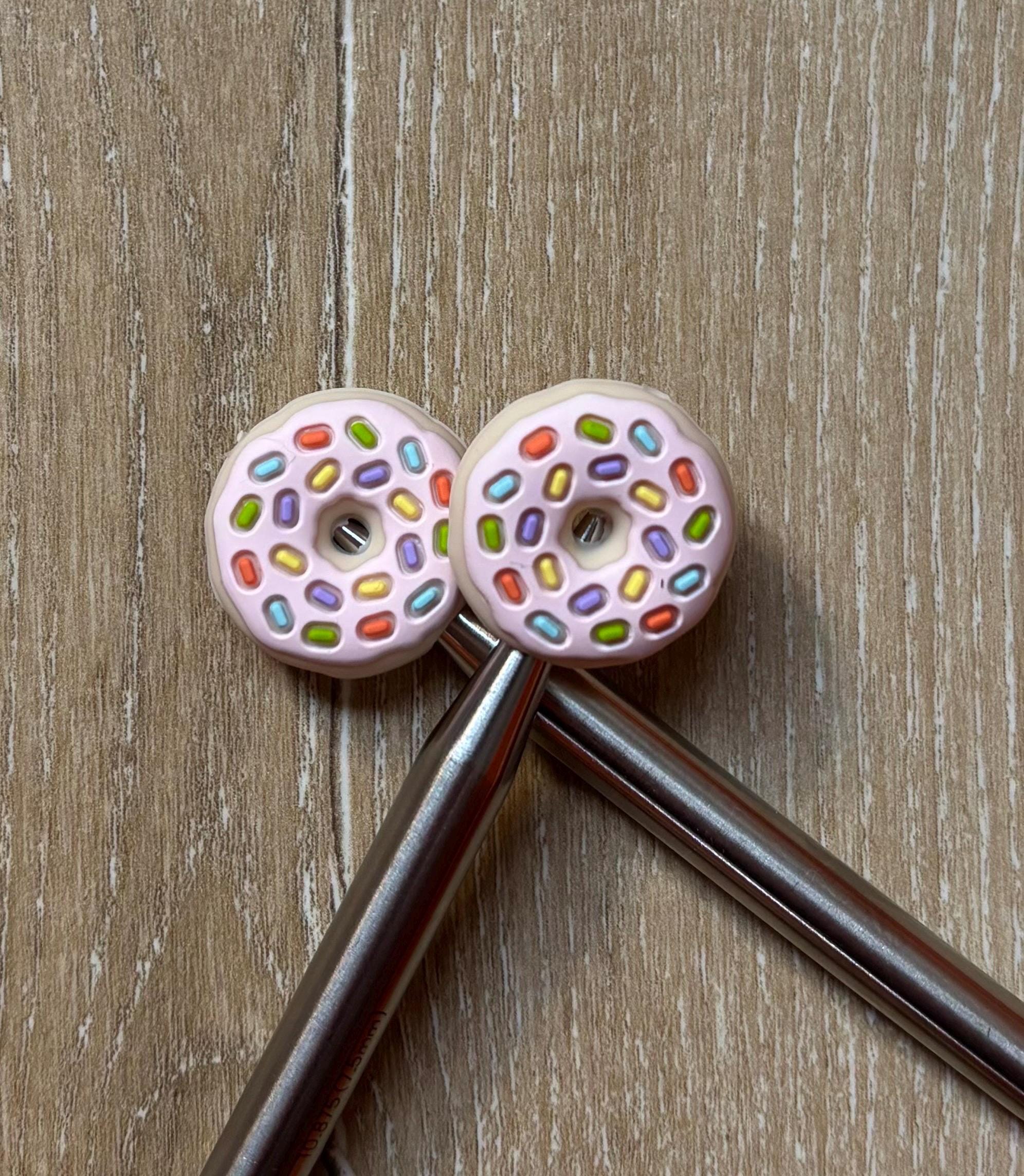 Donut needle stoppers for knitting needles