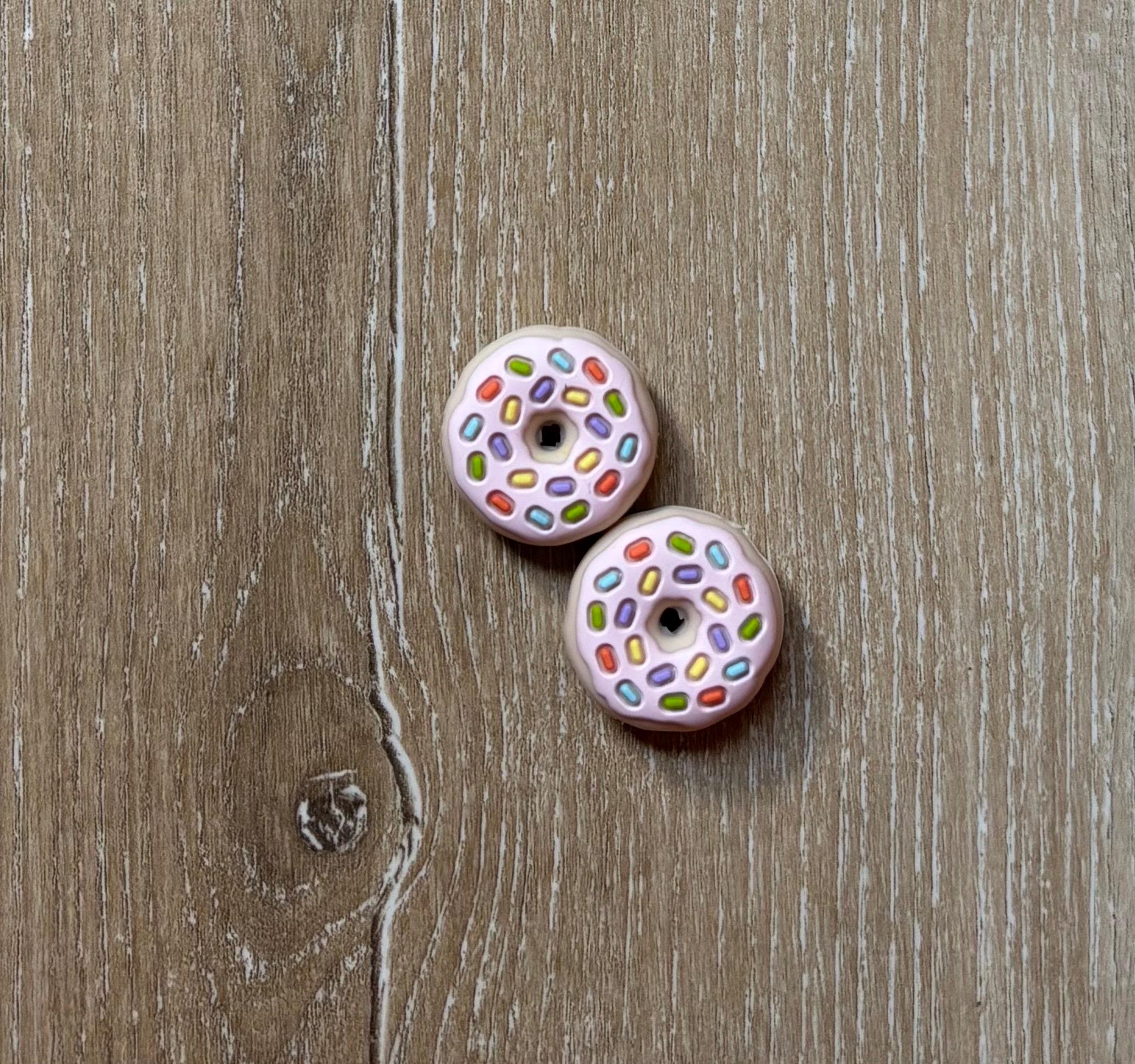 Donut needle stoppers for knitting needles