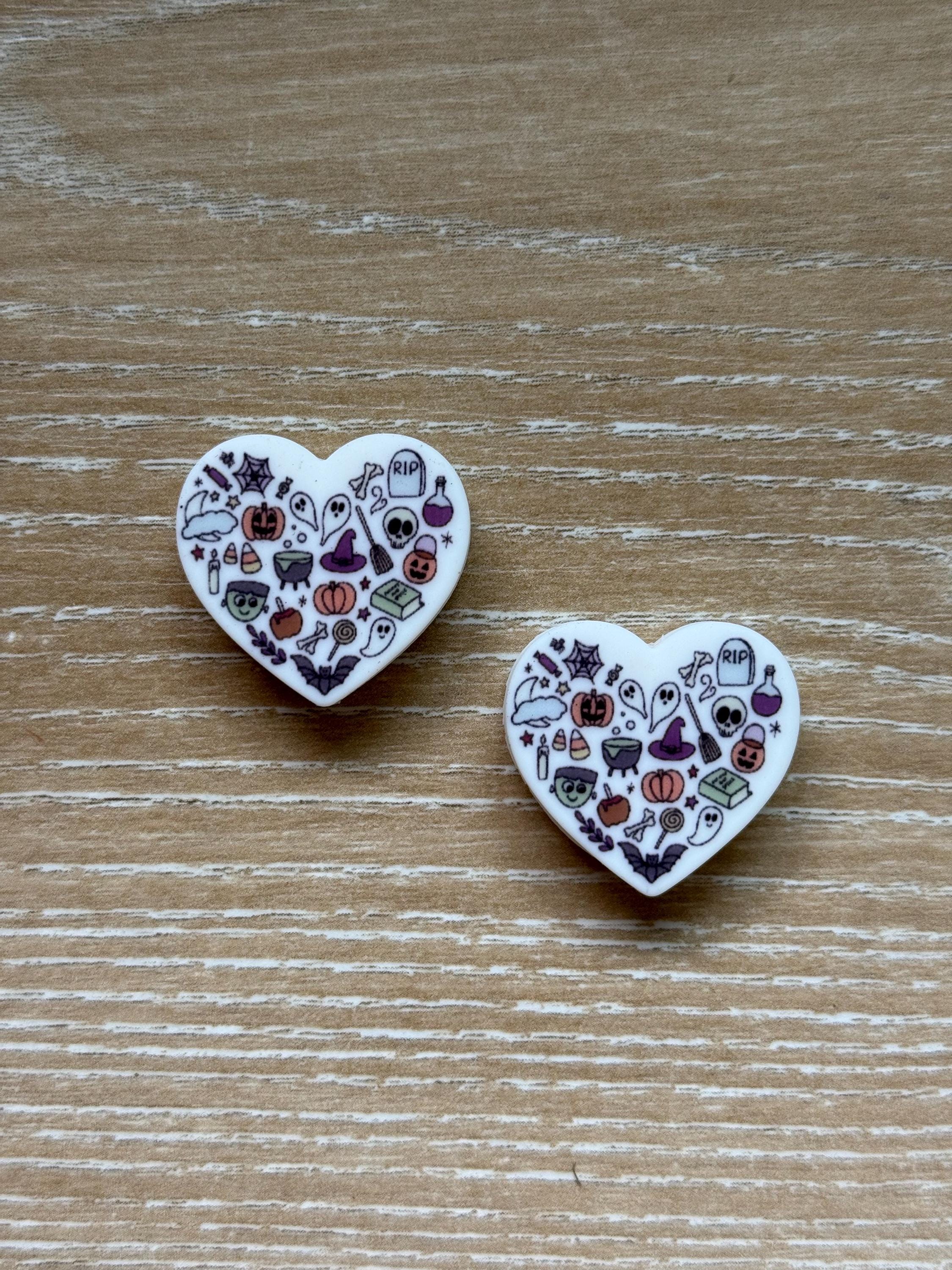 Heart needle stoppers for knitting needles