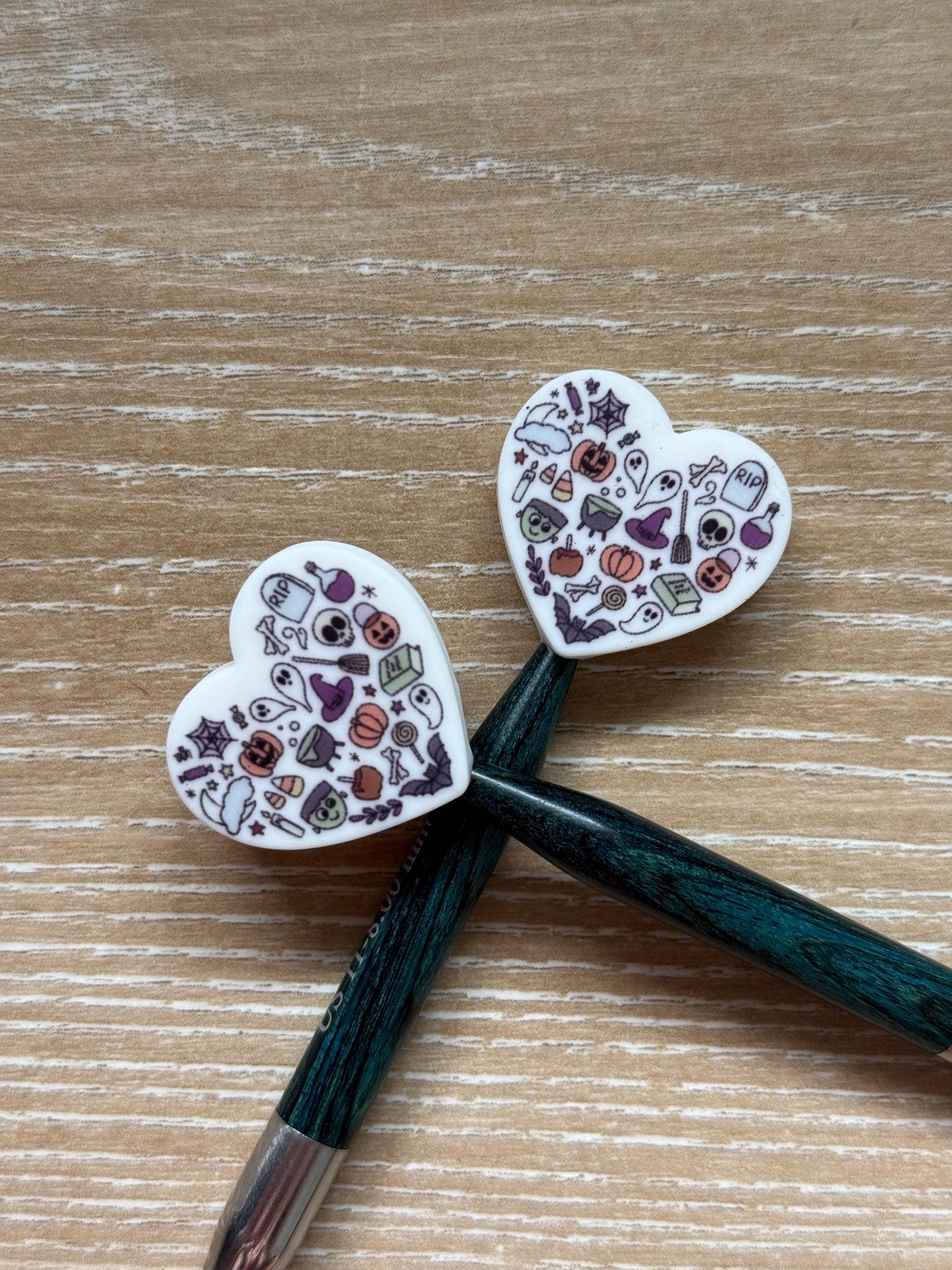 Heart needle stoppers for knitting needles