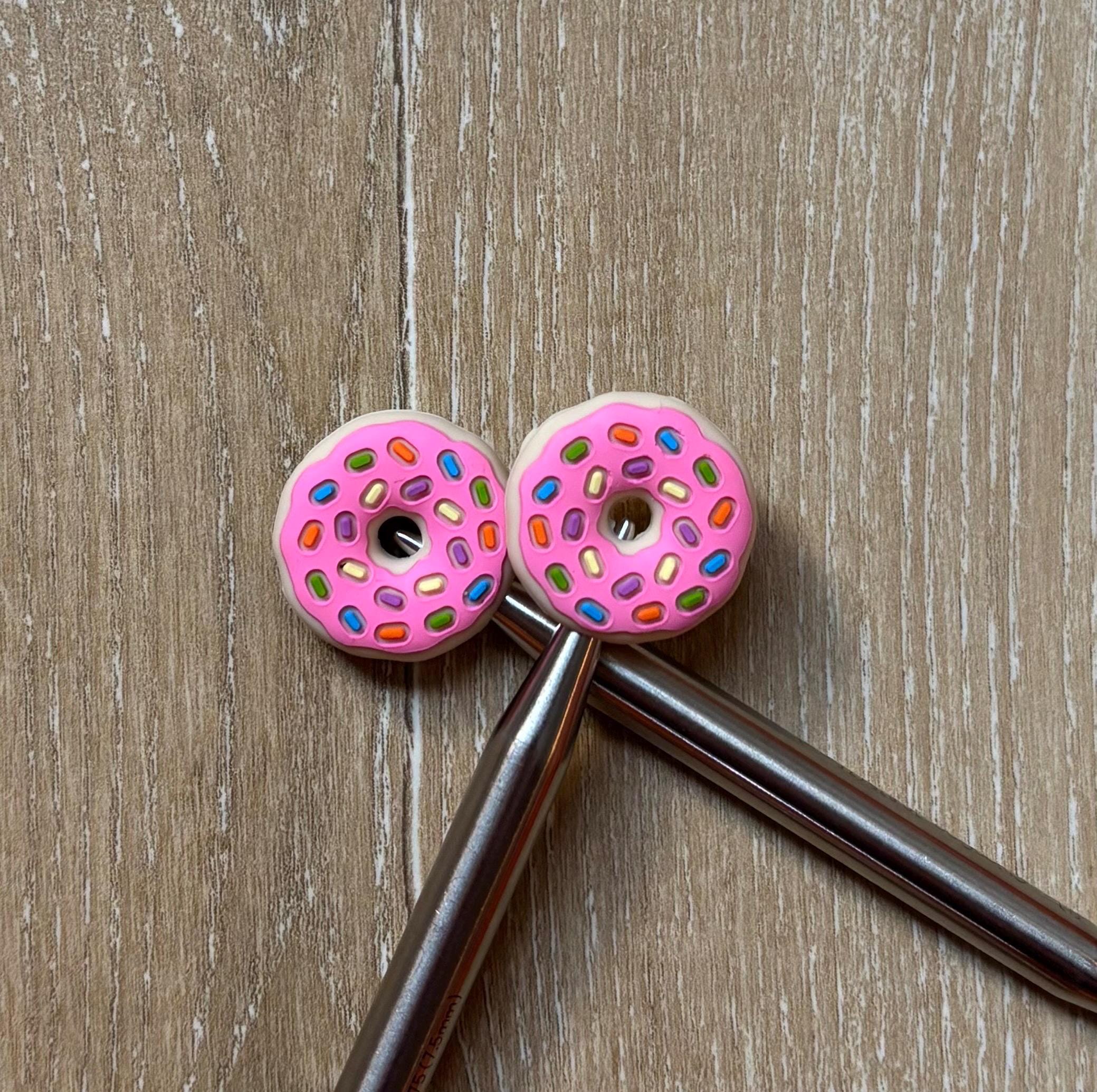 Donut needle stoppers for knitting needles