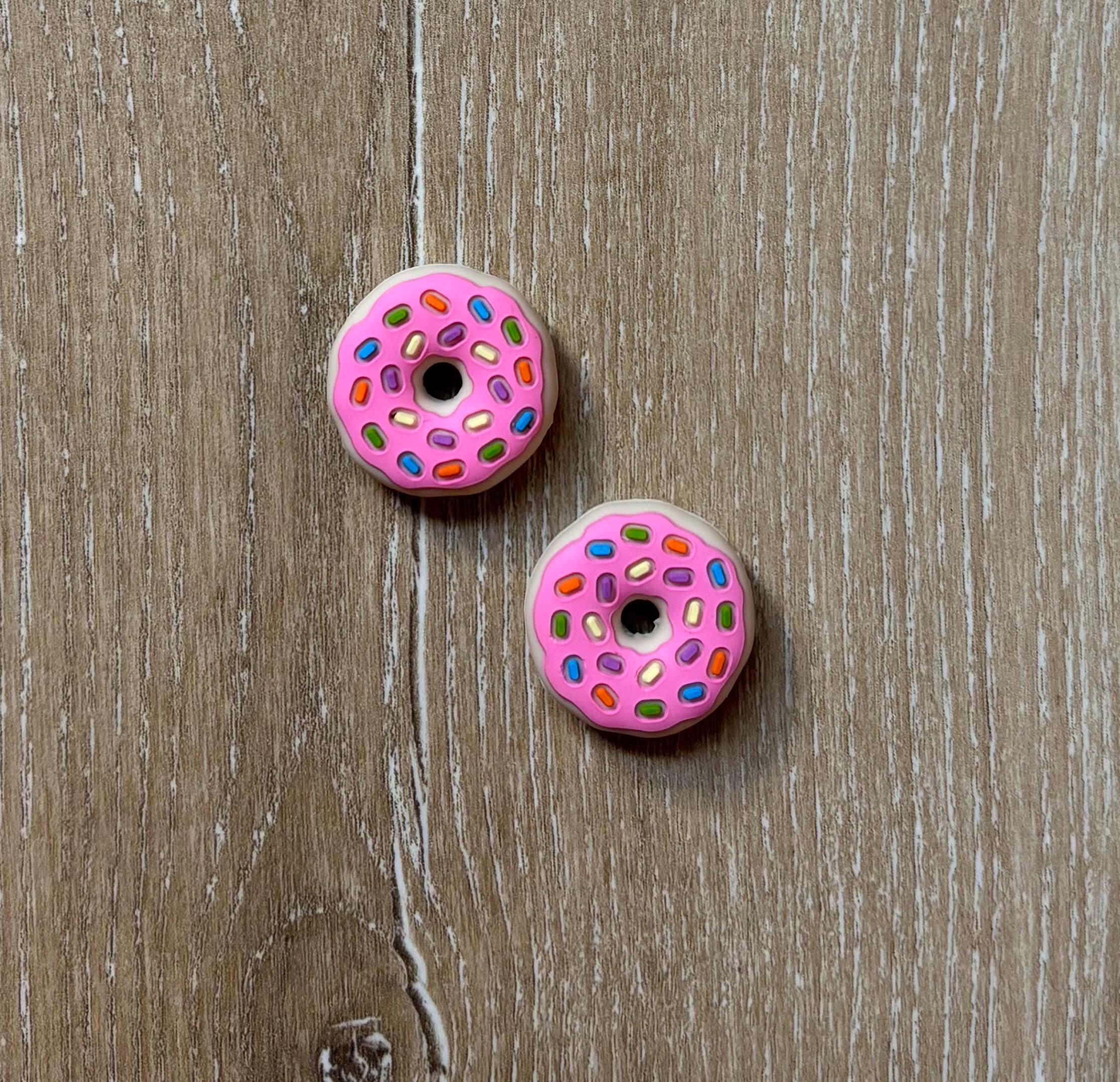 Donut needle stoppers for knitting needles