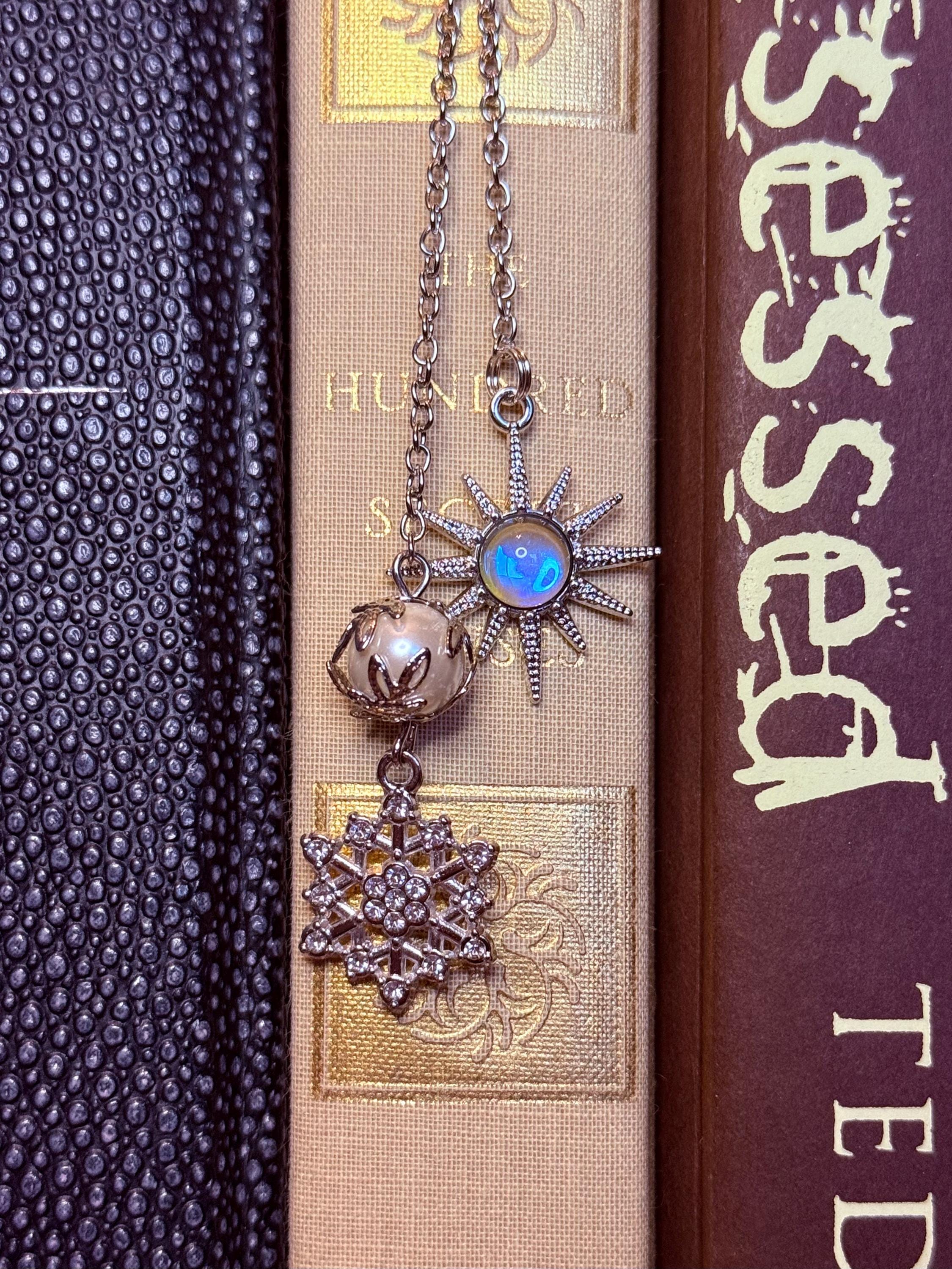 Sun and snowflake handmade metal bookmark