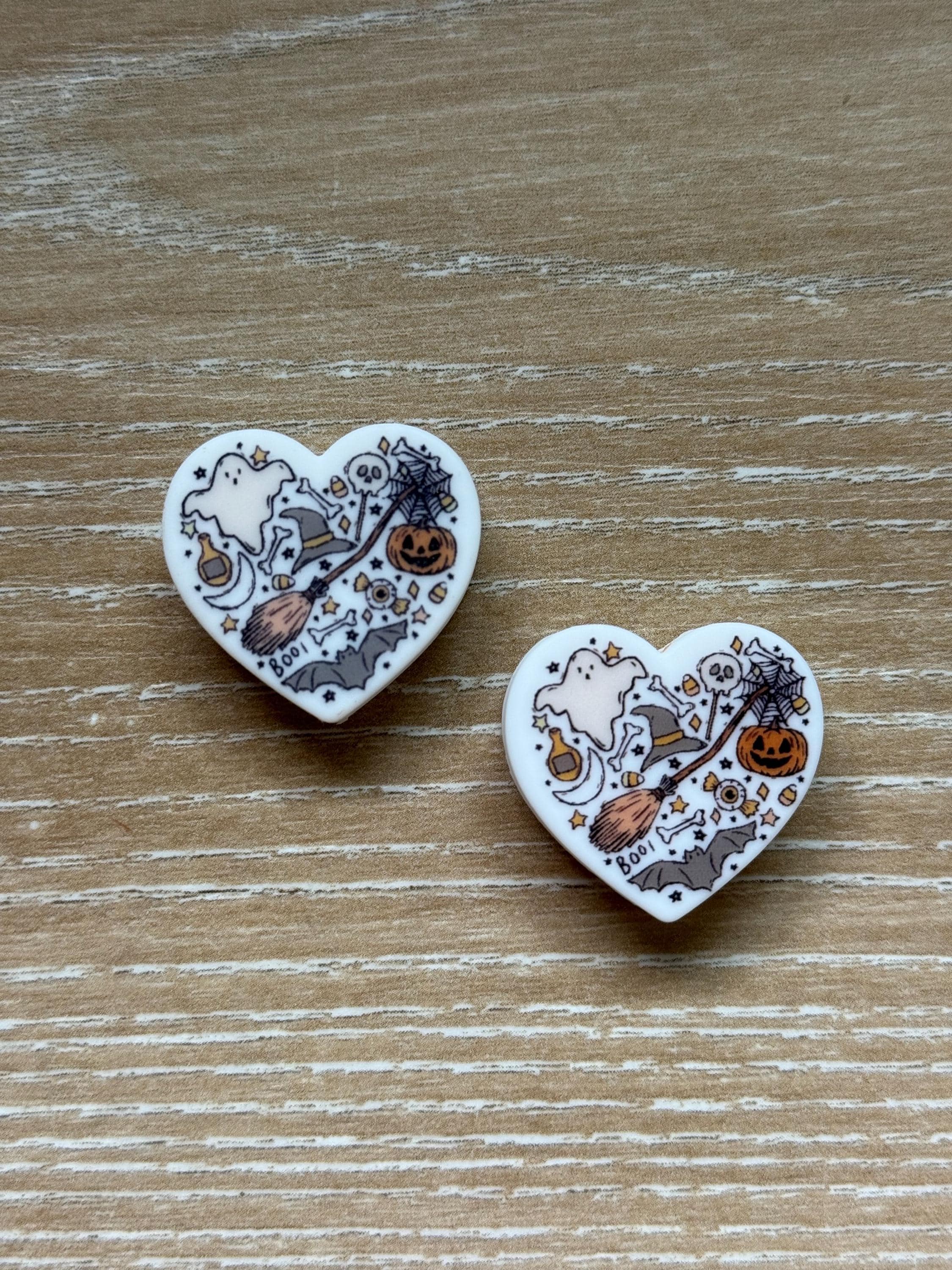 Heart needle stoppers for knitting needles