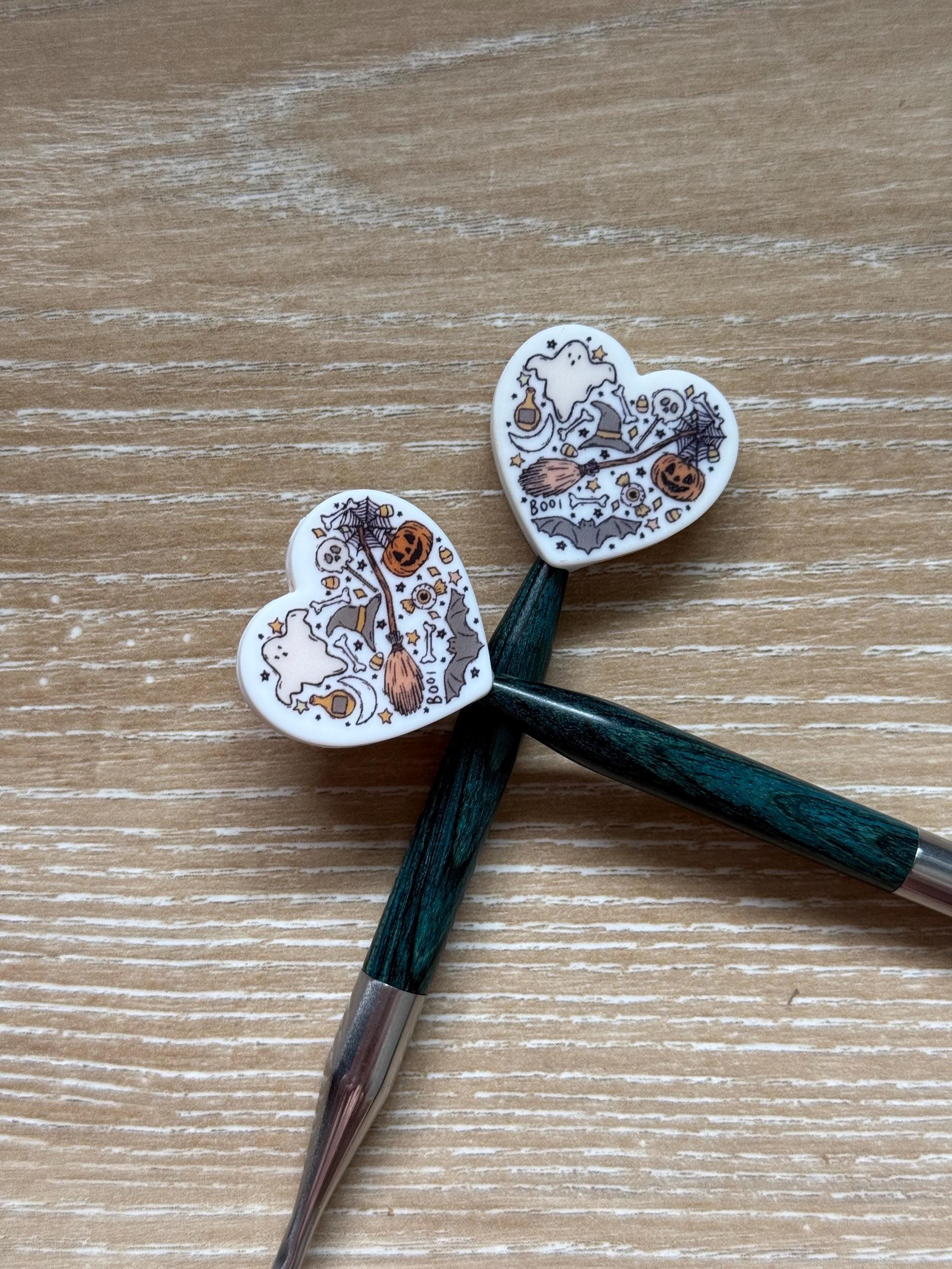 Heart needle stoppers for knitting needles