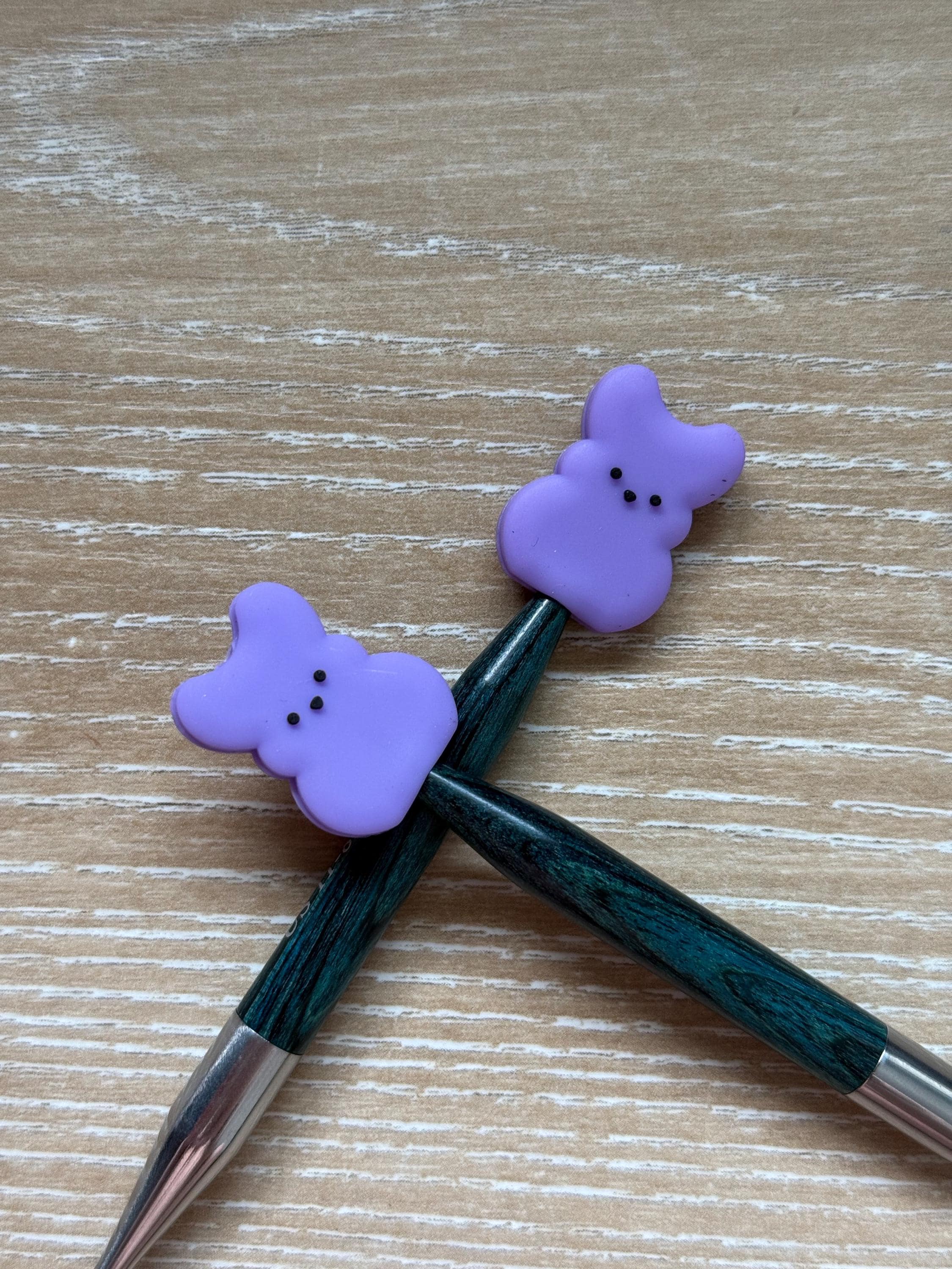 Peeps needle stoppers for knitting needles