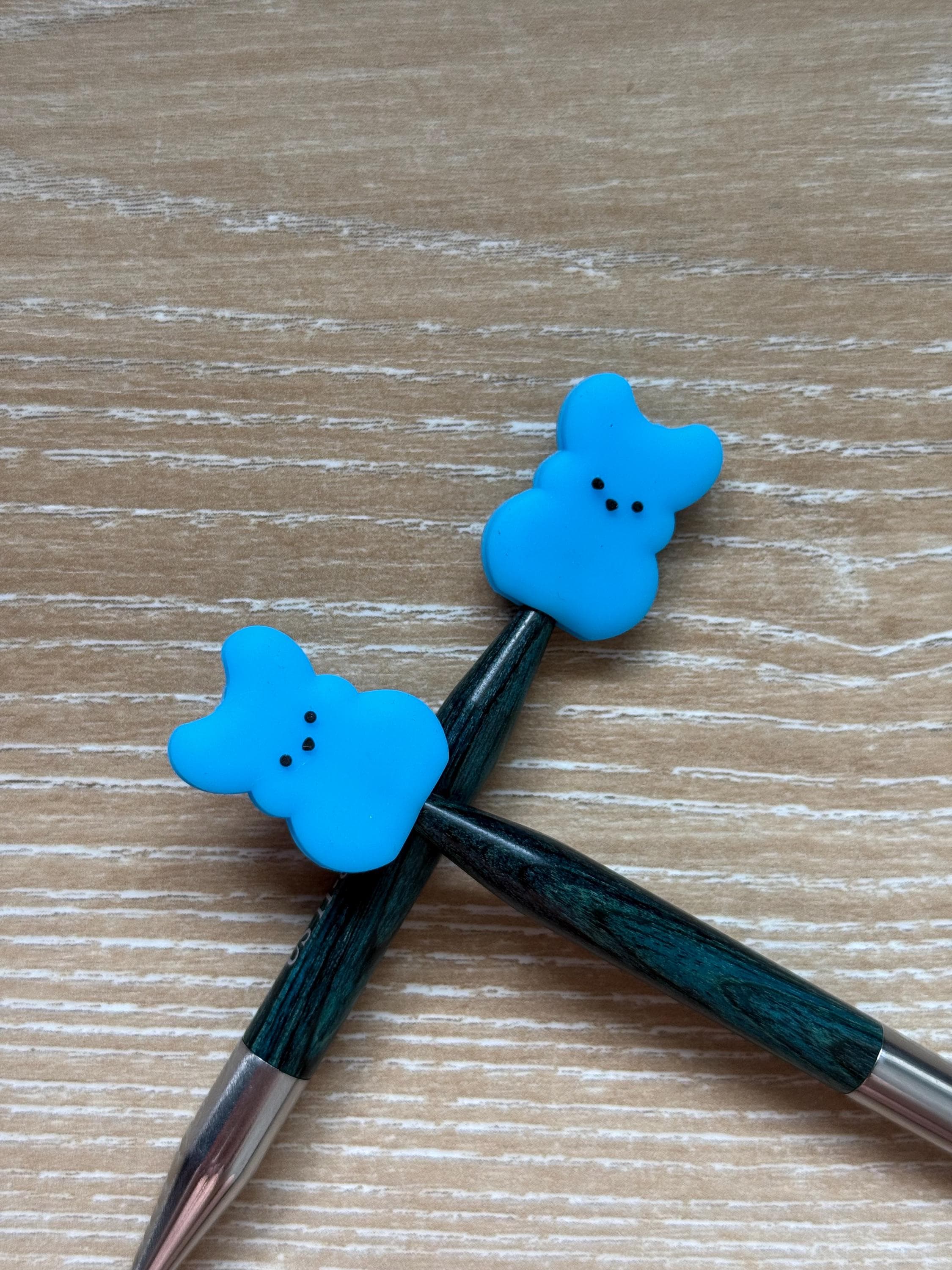 Peeps needle stoppers for knitting needles