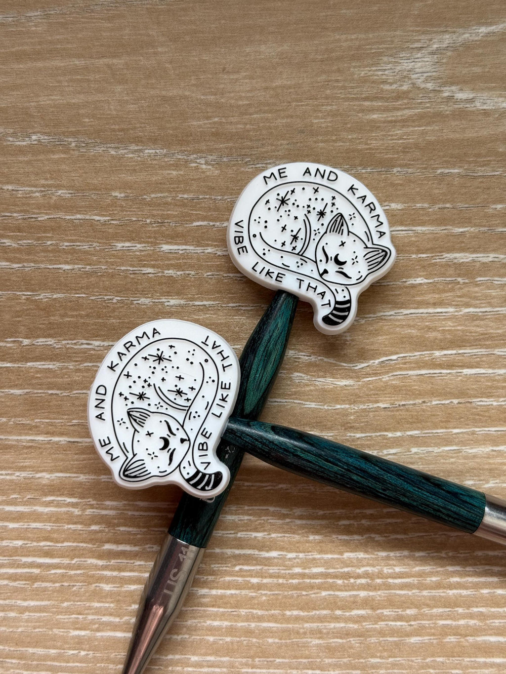 Karma needle stoppers for knitting needles