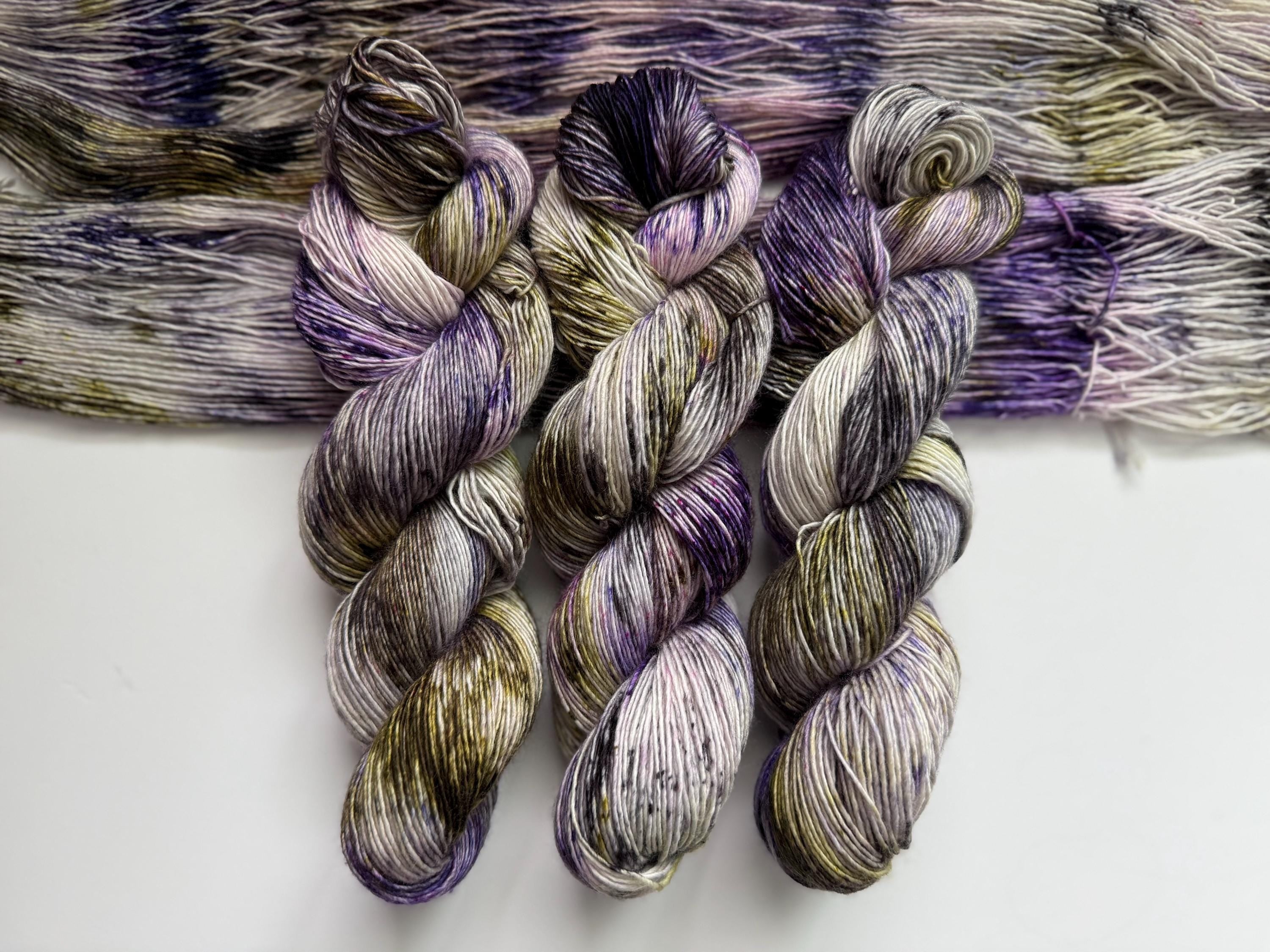 Pansy garden hand dyed (sock/fingering) merino wool, superwash yarn, green purple black, hank of yarn , for knit crochet