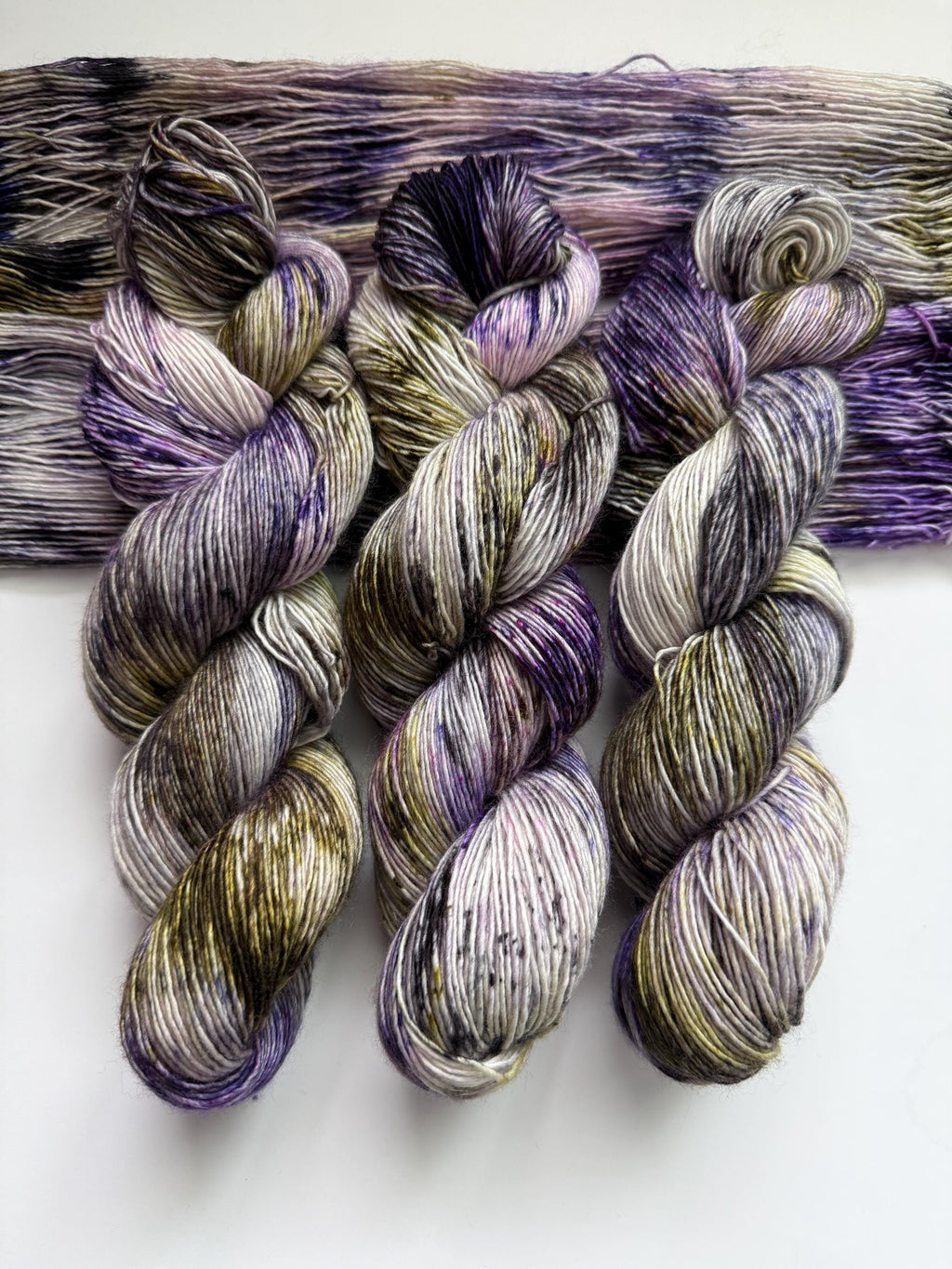 Pansy garden hand dyed (sock/fingering) merino wool, superwash yarn, green purple black, hank of yarn , for knit crochet