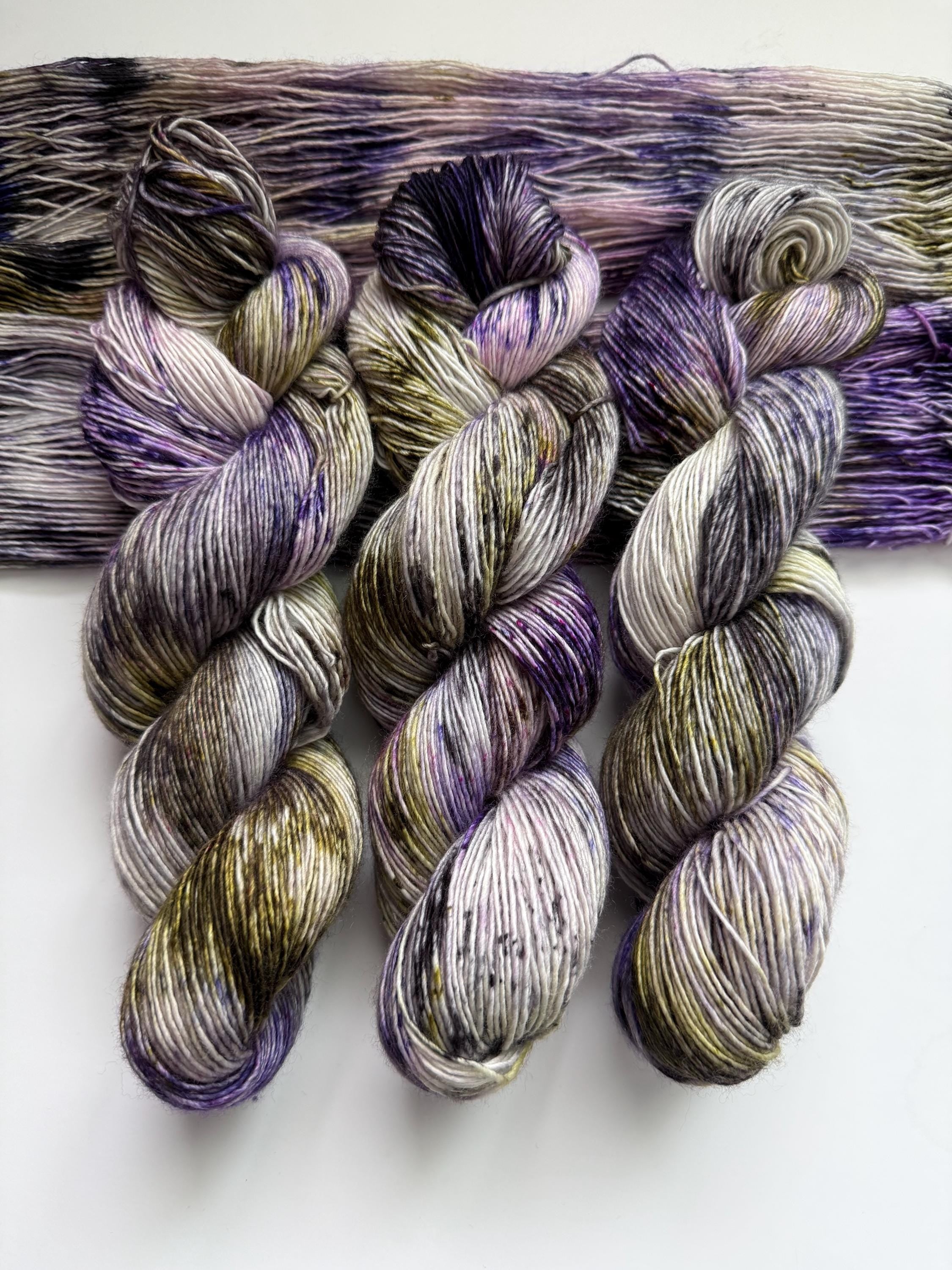 Pansy garden hand dyed (sock/fingering) merino wool, superwash yarn, green purple black, hank of yarn , for knit crochet