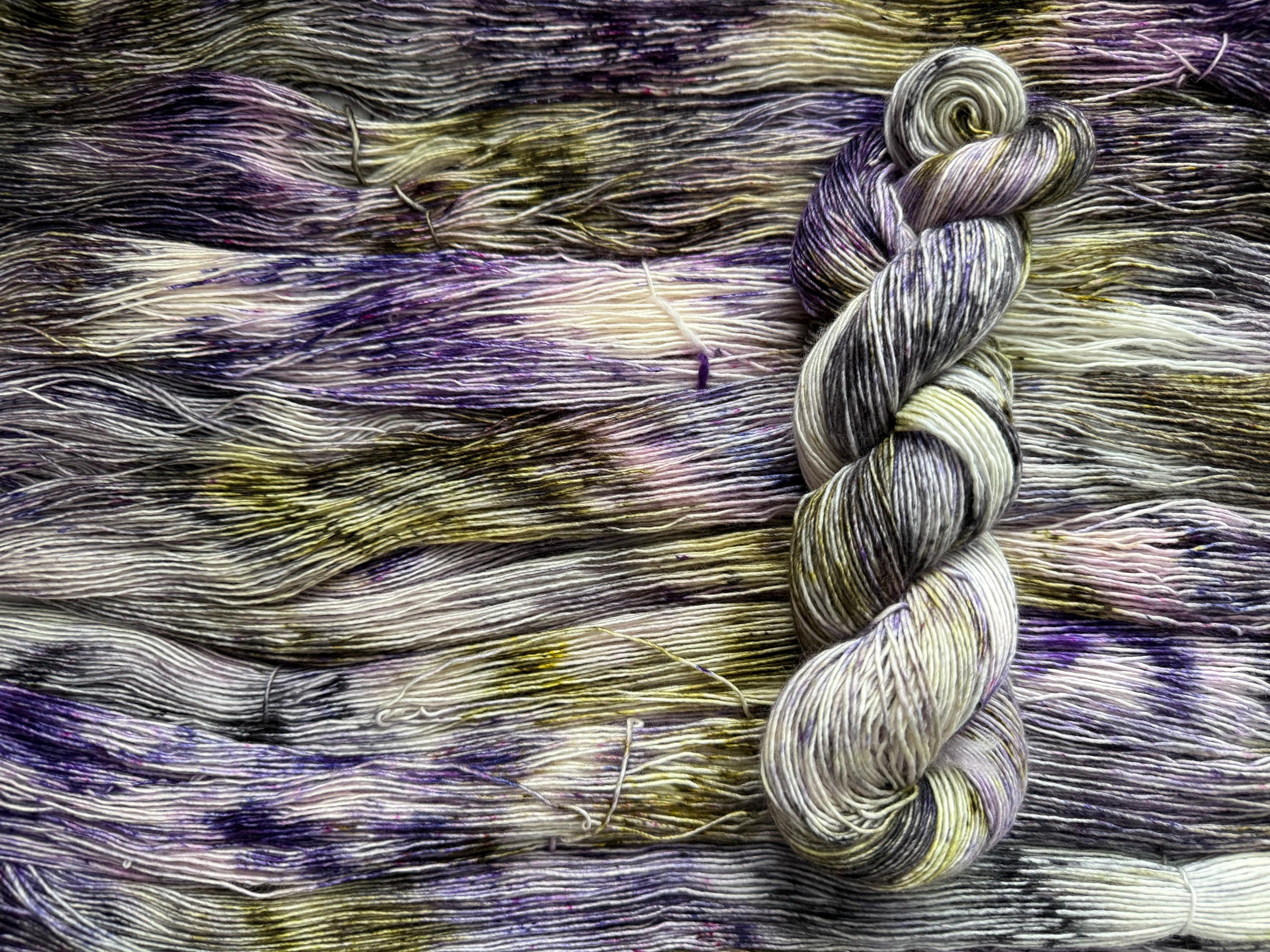 Pansy garden hand dyed (sock/fingering) merino wool, superwash yarn, green purple black, hank of yarn , for knit crochet