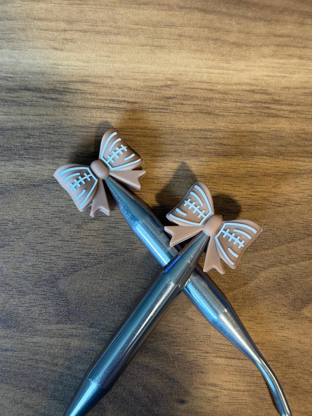 Needle stoppers for knitting needles, football bow, stitch stopper