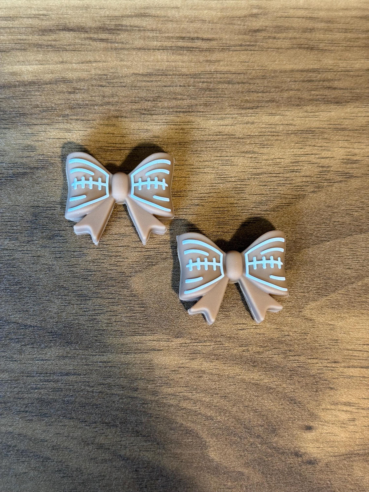 Needle stoppers for knitting needles, football bow, stitch stopper